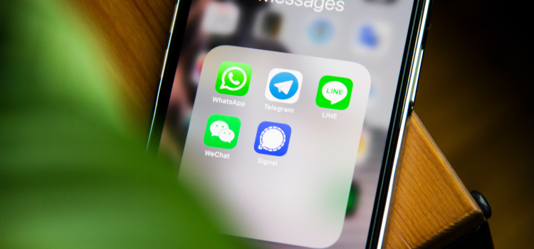 close up of phone screen with text app on it